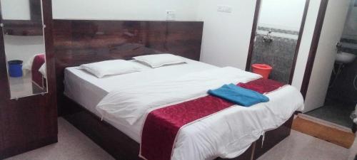 Ένα ή περισσότερα κρεβάτια σε δωμάτιο στο POP 84129A Kk Residency