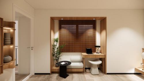 a room with a desk and a chair and a window at Bogorienze City Resort in Pamoyanan