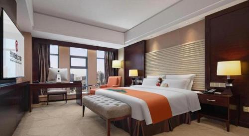 Postel nebo postele na pokoji v ubytování White Swan Hotel ChangSha