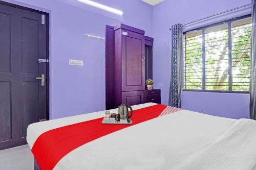 Ένα ή περισσότερα κρεβάτια σε δωμάτιο στο Collection O Clement Holydays