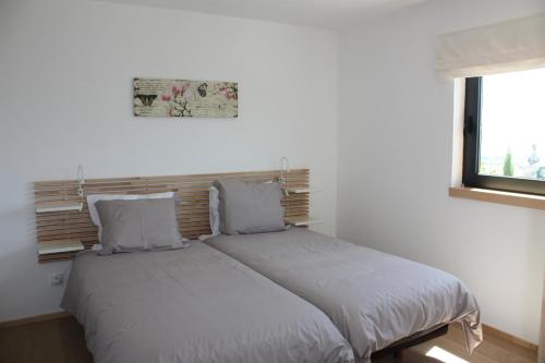 Ένα ή περισσότερα κρεβάτια σε δωμάτιο στο Casa Nª Sra. do Carmo - Villas