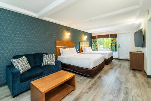 Ένα ή περισσότερα κρεβάτια σε δωμάτιο στο Quality Inn & Suites