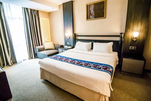Ένα ή περισσότερα κρεβάτια σε δωμάτιο στο KK Times Square Hotel