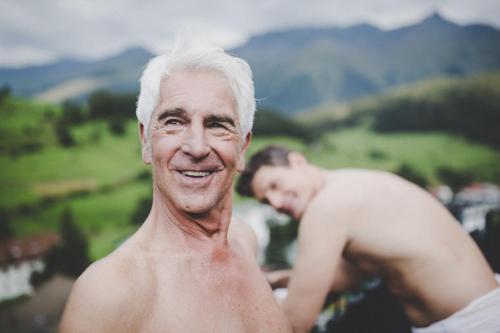 an older man standing next to a young man at Arabella Retreat & Spa in Nauders