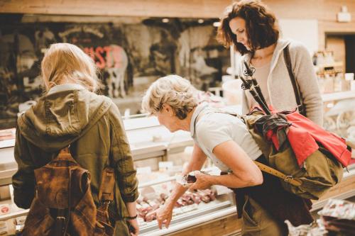 two women standing in a store looking at meat at Arabella Retreat & Spa in Nauders