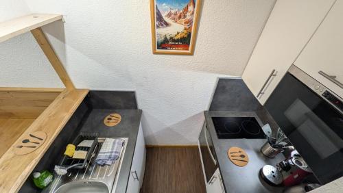 Kuchyň nebo kuchyňský kout v ubytování L'alpage