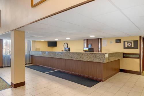 a lobby of a hospital with a reception counter at Clarion Hotel & Conference Center Lansing West in Lansing