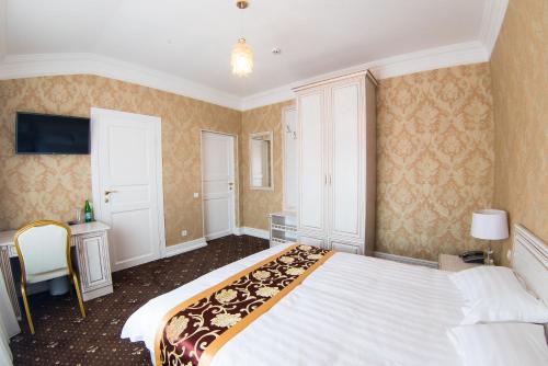 Postel nebo postele na pokoji v ubytování Hotel Grand Aristocrate