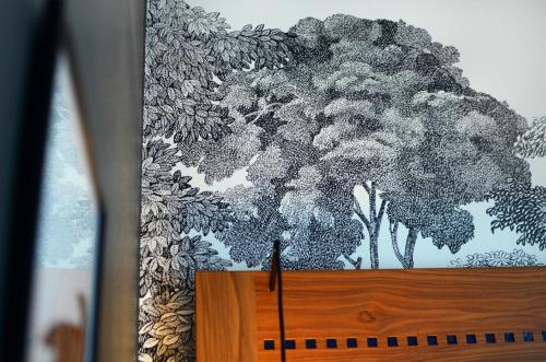 a drawing of a tree on a wall at Home Hotel Temperance in Malmö