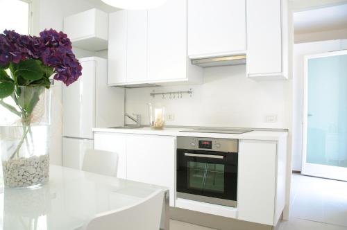 Kuchyň nebo kuchyňský kout v ubytování Eco Apartments Cervia