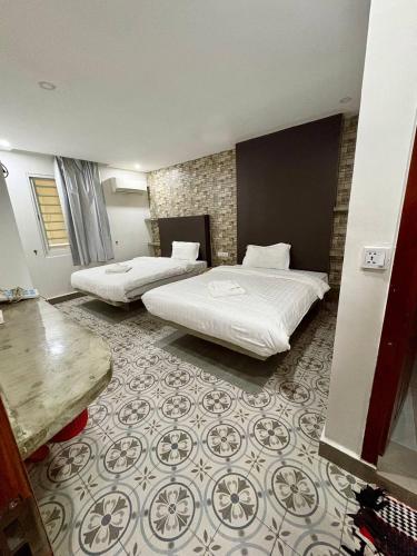 Ένα ή περισσότερα κρεβάτια σε δωμάτιο στο 君悦酒店