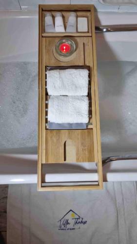 a wooden compartment with towels in the back of a boat at Villa Thabiso in Bulawayo