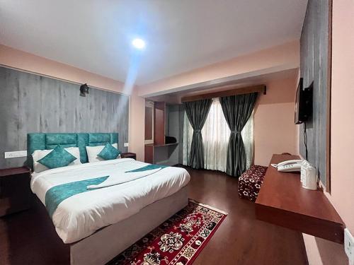 En eller flere senge i et værelse på Rare Himalayas Mansarovar