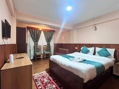 En eller flere senge i et værelse på Rare Himalayas Mansarovar