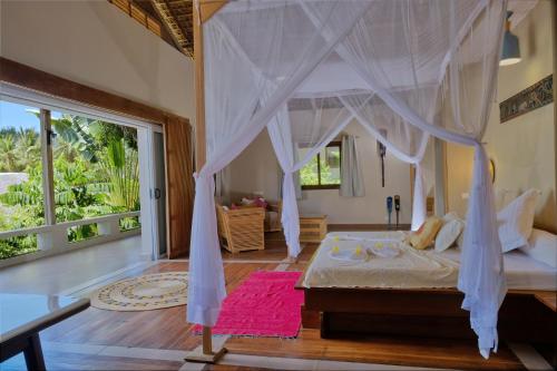 Postel nebo postele na pokoji v ubytování Sakatia Passions