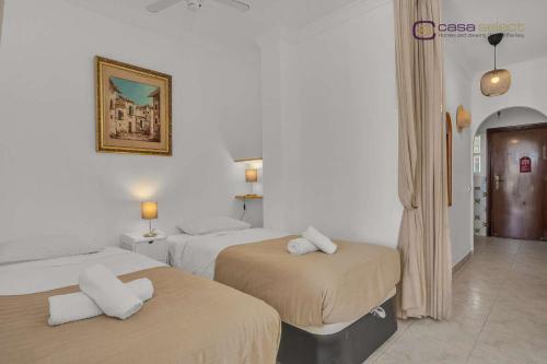 Ένα ή περισσότερα κρεβάτια σε δωμάτιο στο Beautiful bungalow on the Torrox-Costa boulevard!