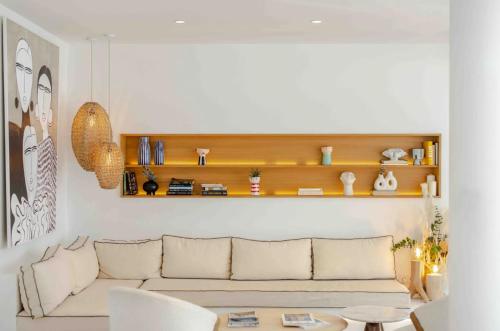 a living room with a couch and a table at Hotel Port Salins by Pierre & Vacances in Empuriabrava
