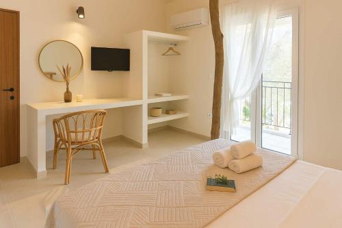 Ένα ή περισσότερα κρεβάτια σε δωμάτιο στο Corfu's Hidden Gem - Serene Quad