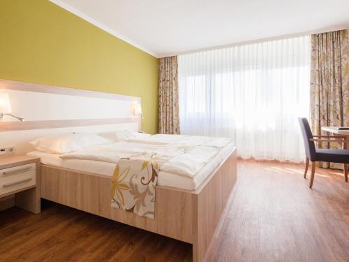 Giường trong phòng chung tại GDA Hildastift am Kurpark