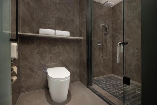 Koupelna v ubytování Huanman Hotel Luoyang Yingtianmen Jiefang Road Metro Station Branch