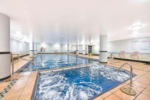 a large swimming pool in a large building at Pyrmont 2 Bed Apartment - Prime Location w parking in Sydney
