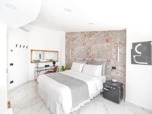 Ένα ή περισσότερα κρεβάτια σε δωμάτιο στο nakyro suite