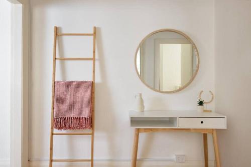 a bathroom with a mirror and a sink and a ladder at Edward Escape - Short Walk to Beach in Sydney