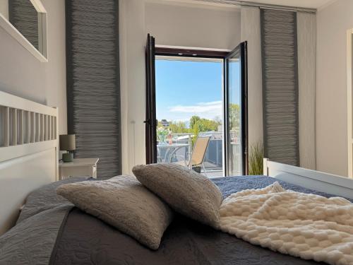 Кровать или кровати в номере Ferienwohnungen Briesenick Radde