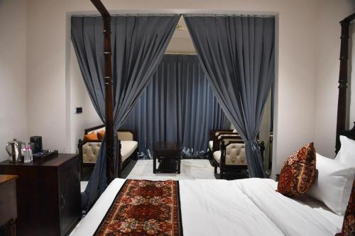 Ένα ή περισσότερα κρεβάτια σε δωμάτιο στο Hotel Rosemary Inn