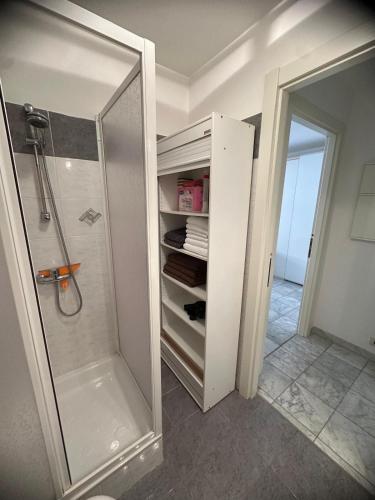 a bathroom with a shower and a walk in closet at Studio grande terrasse 2 min plage & commerces in Roquebrune-Cap-Martin