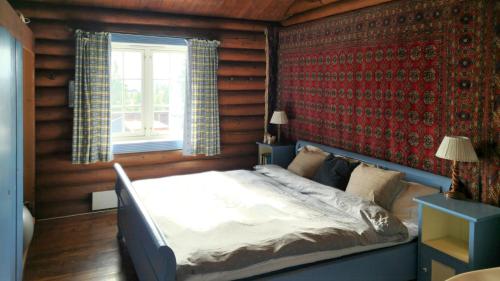 En eller flere senge i et værelse på Historic Cabin From 1906 In Sjusjøen