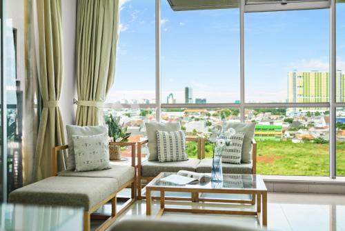 Et opholdsområde på Lily by Kozystay - Kuningan