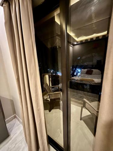 a view of a room with a bed through a window at Hotel Sejal in Calangute
