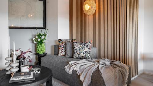 Ένα ή περισσότερα κρεβάτια σε δωμάτιο στο COSMOPOLITAN APARTMENTS Zürich Seefeld