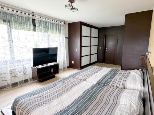 En eller flere senge i et værelse på Espectacular casa con piscina