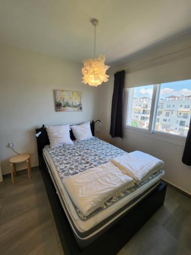 Ένα ή περισσότερα κρεβάτια σε δωμάτιο στο Exclusive Apartments in Thalassa Beach Resort