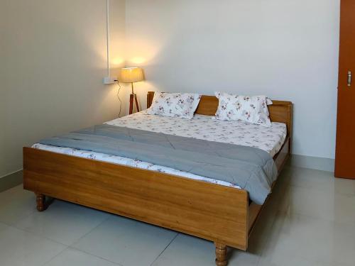 Ένα ή περισσότερα κρεβάτια σε δωμάτιο στο Oakwood HomeStay