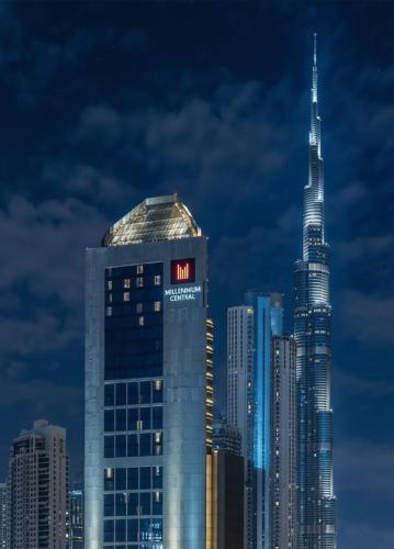 a view of a city skyline with a tall skyscraper at Millennium Central Downtown - Dubai in Dubai