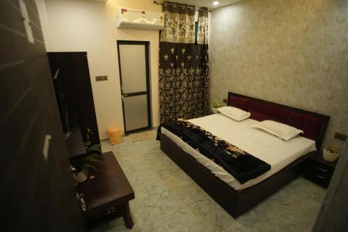 Ένα ή περισσότερα κρεβάτια σε δωμάτιο στο Jiwaji Palace