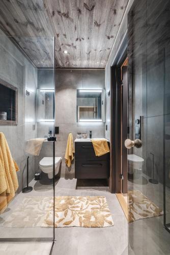 a bathroom with a shower and a sink and a tub at Nyørk Chalet, Hemsedal in Hemsedal