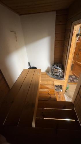 a room with a wooden floor in a house at Villa Vanttaja in Kuusamo