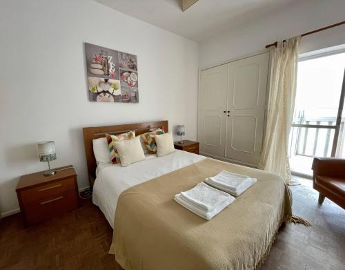 Ένα ή περισσότερα κρεβάτια σε δωμάτιο στο Yvonne Beach Apartment by Refugio