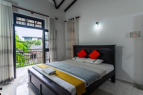 Ένα ή περισσότερα κρεβάτια σε δωμάτιο στο Tharan Villa - House in Colombo