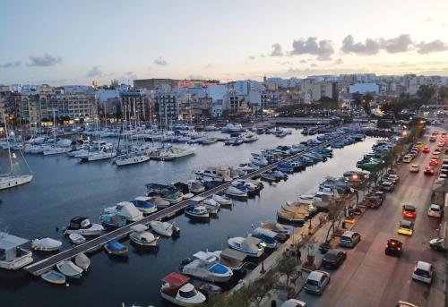 a harbor filled with lots of boats in the water at Sea view Spacious 2 bedroom central apartment in Msida