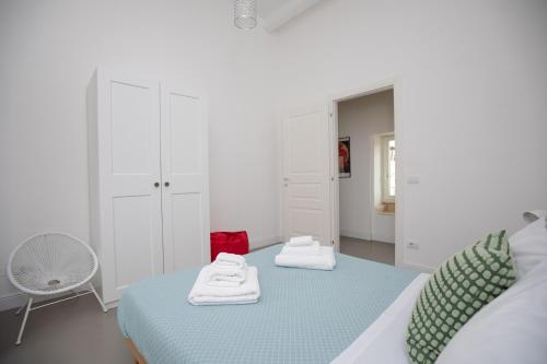 Ένα ή περισσότερα κρεβάτια σε δωμάτιο στο Casa Cadur