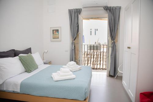 Ένα ή περισσότερα κρεβάτια σε δωμάτιο στο Casa Cadur