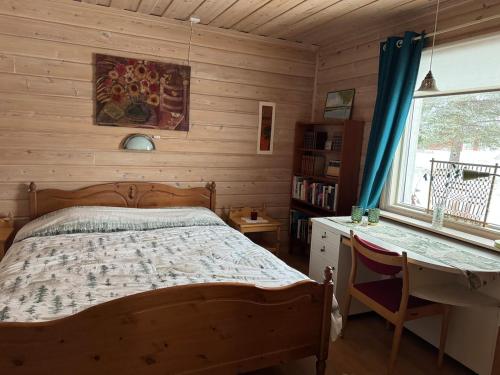 Ένα ή περισσότερα κρεβάτια σε δωμάτιο στο Entire home in Muodoslompolo