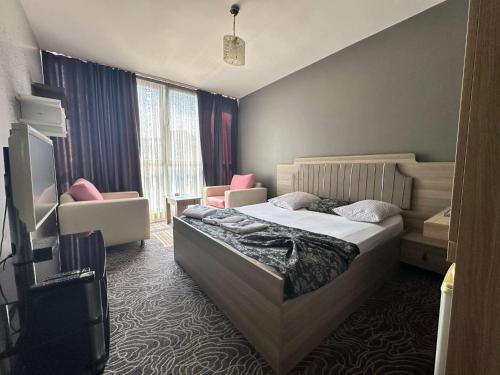 Ένα ή περισσότερα κρεβάτια σε δωμάτιο στο Beyhouse Konaklama