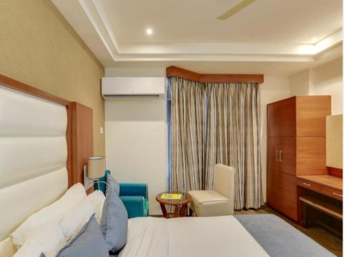 Una cama o camas en una habitación de Hotel Yatrik