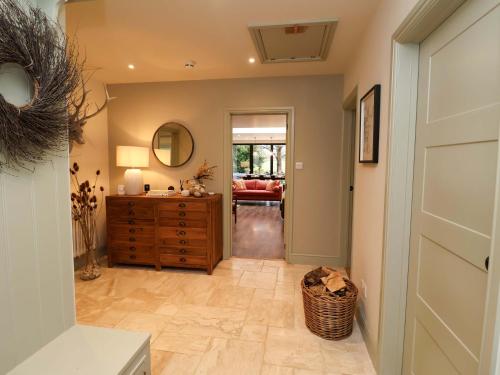 a hallway with a door leading to a living room at Fairview in Saxmundham